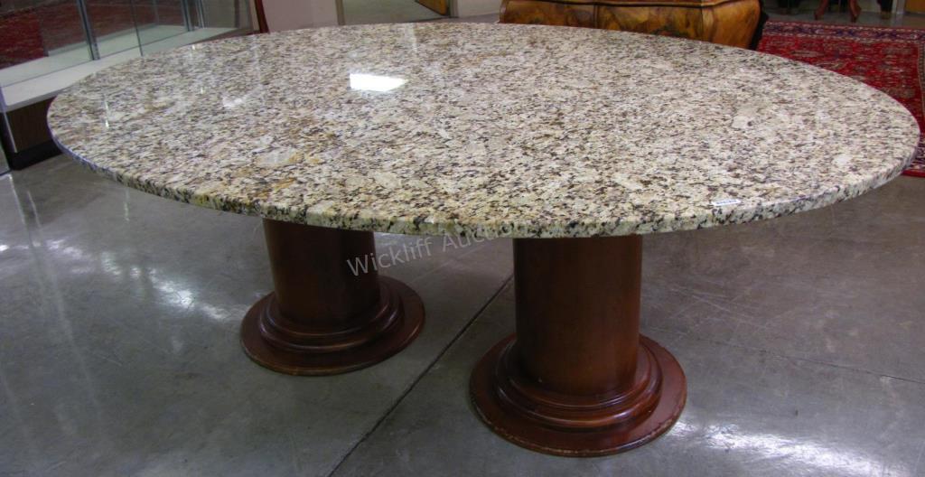 Appraisal: An oval conference table with thick beige granite top setting