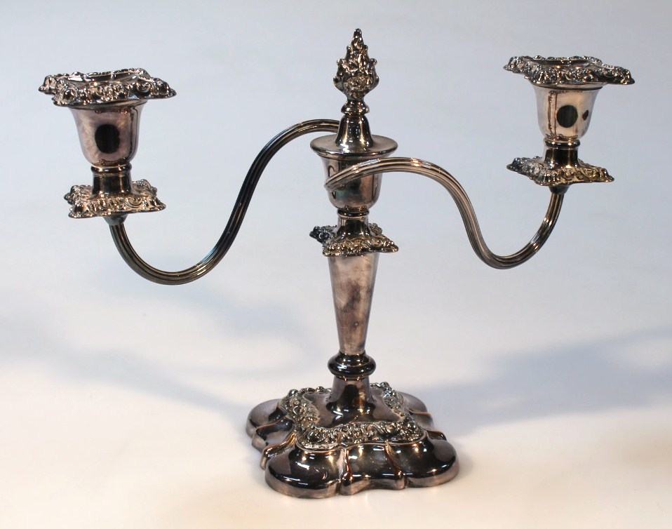 Appraisal: A silver plated two branch candelabra with reeded branches and