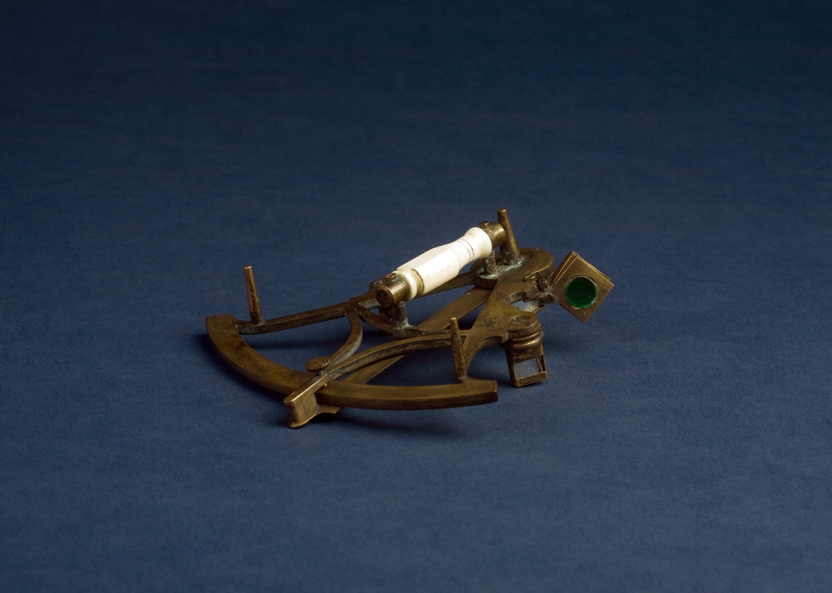 Appraisal: MINIATURE BRASS STEEL AND IVORY SEXTANT The model a perfect