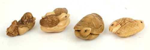 Appraisal: A COLLECTION OF FOUR VEGETABLE IVORY NETSUKE Including ducks fish