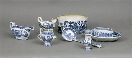 Appraisal: Eight 'Blue Willow' Pottery Articles Including a sauceboat cow creamer