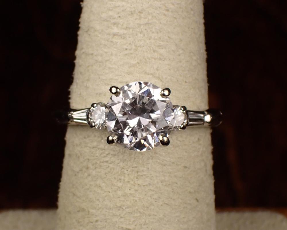 Appraisal: DIAMOND AND FOURTEEN KARAT WHITE GOLD RING with a round