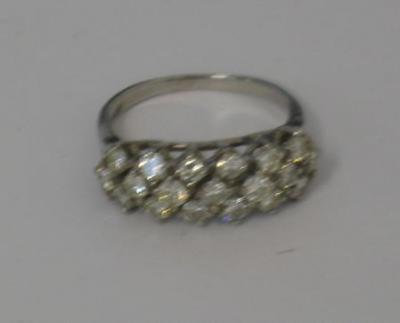 Appraisal: A DIAMOND RING comprising three rows of brilliant cut diamonds