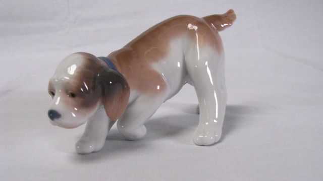 Appraisal: Lladro figurine Little Hunter depicting pointing beagle tall issued in