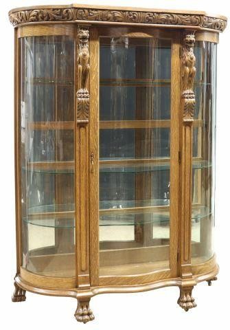 Appraisal: American oak display cabinet early th c carved frieze with