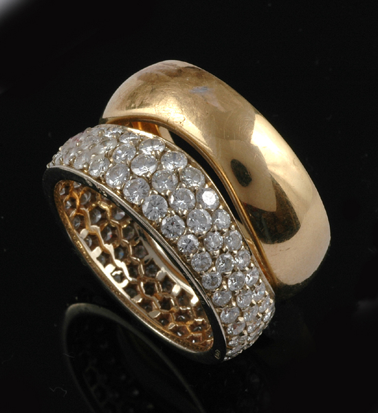 Appraisal: A DIAMOND RING AND MATCHING GOLD BAND BY CARTIER The