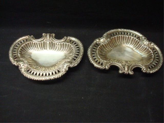 Appraisal: English silver footed small trays Bearing hallmarks serpentine with bun