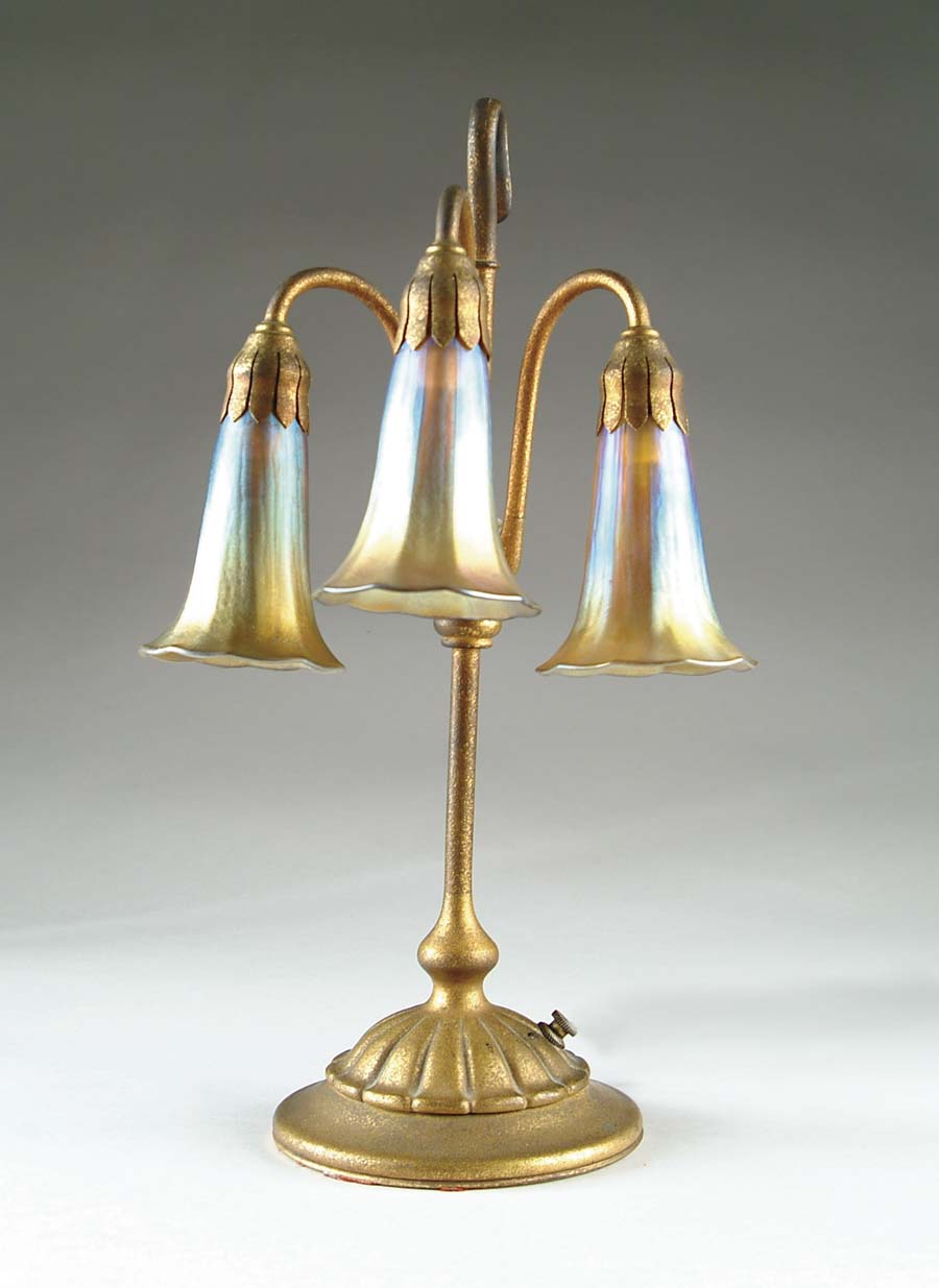 Appraisal: TIFFANY THREE LIGHT LILY LAMP The lamp begins with a