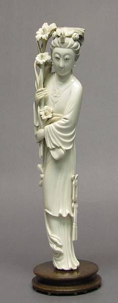 Appraisal: An ivory figural carving of a beauty th Century The