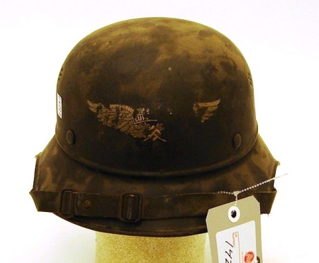 Appraisal: German WWII gladiator-style Luftschutz helmet Complete with liner and chin