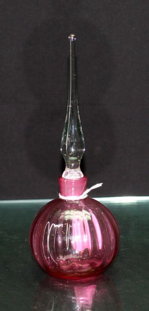 Appraisal: Perfume bottle in cranberry glass with clear stopper