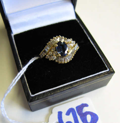 Appraisal: SAPPHIRE DIAMOND AND FOURTEEN KARAT GOLD RING centering a blue