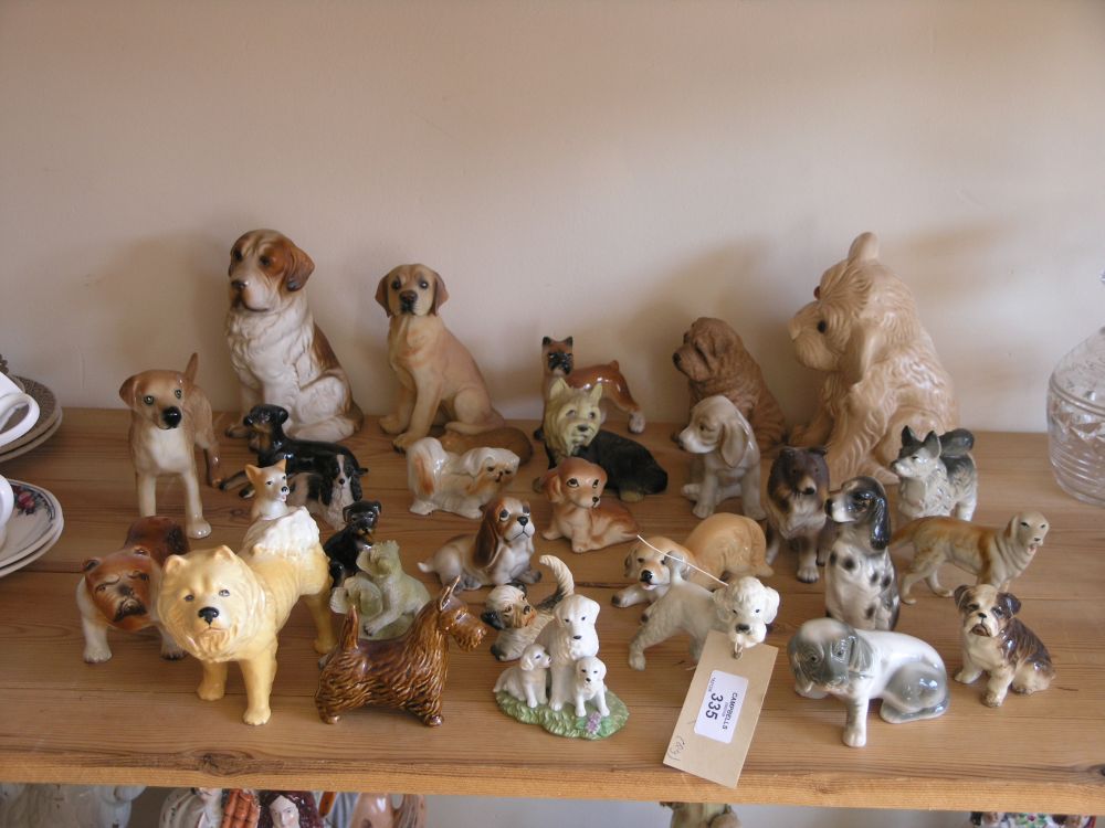 Appraisal: Thirty various ceramic dog models a variety including a Sylvac