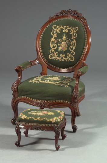 Appraisal: American Rococo Revival-Style Walnut and Needlepoint-Upholstered Armchair and Footstool first