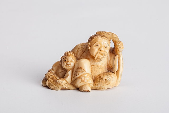 Appraisal: A JAPANESE CARVED IVORY NETSUKE in the form of a