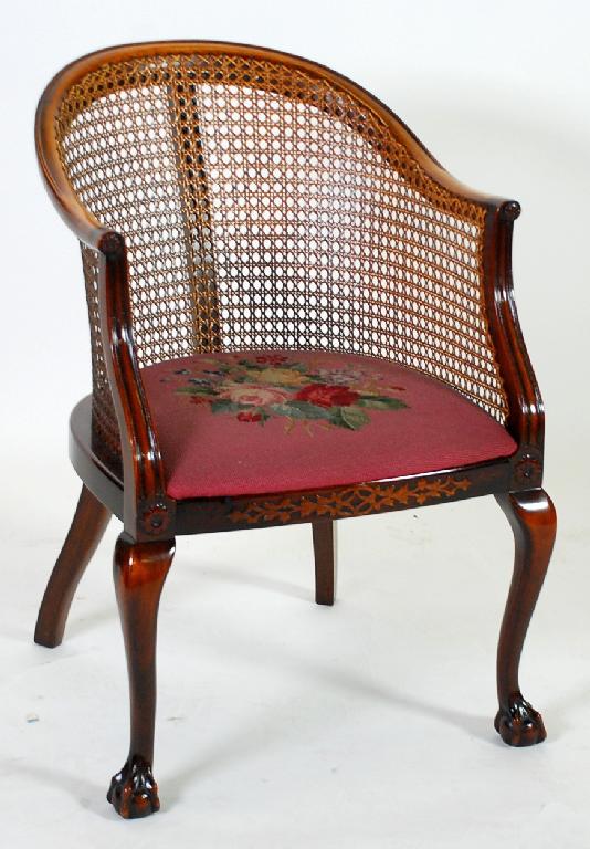 Appraisal: CARVED MAHOGANY BERGERE TUB SHAPED ARMCHAIR with caned back and