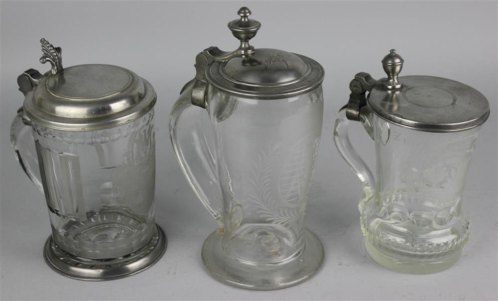 Appraisal: GROUP OF THREE CONTINENTAL ENGRAVED GLASS BEER STEINS th Century