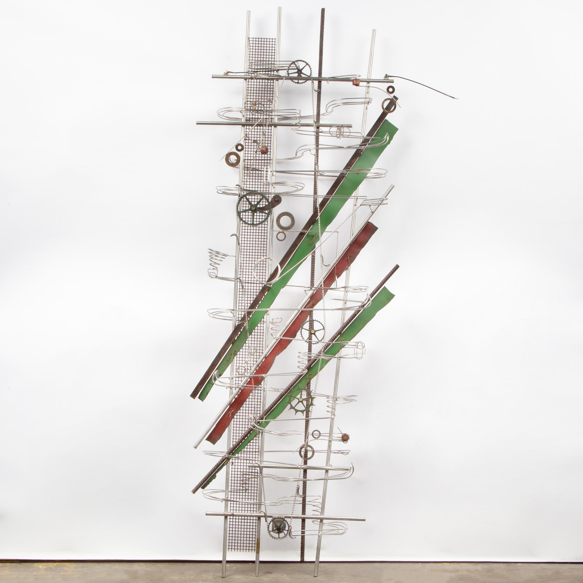 Appraisal: CONTEMPORARY KINETIC WALL SCULPTURE A welded metal kinetic wall sculpture