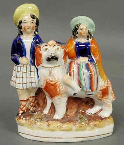 Appraisal: Rare th c Staffordshire figure of children wearing Highland attire