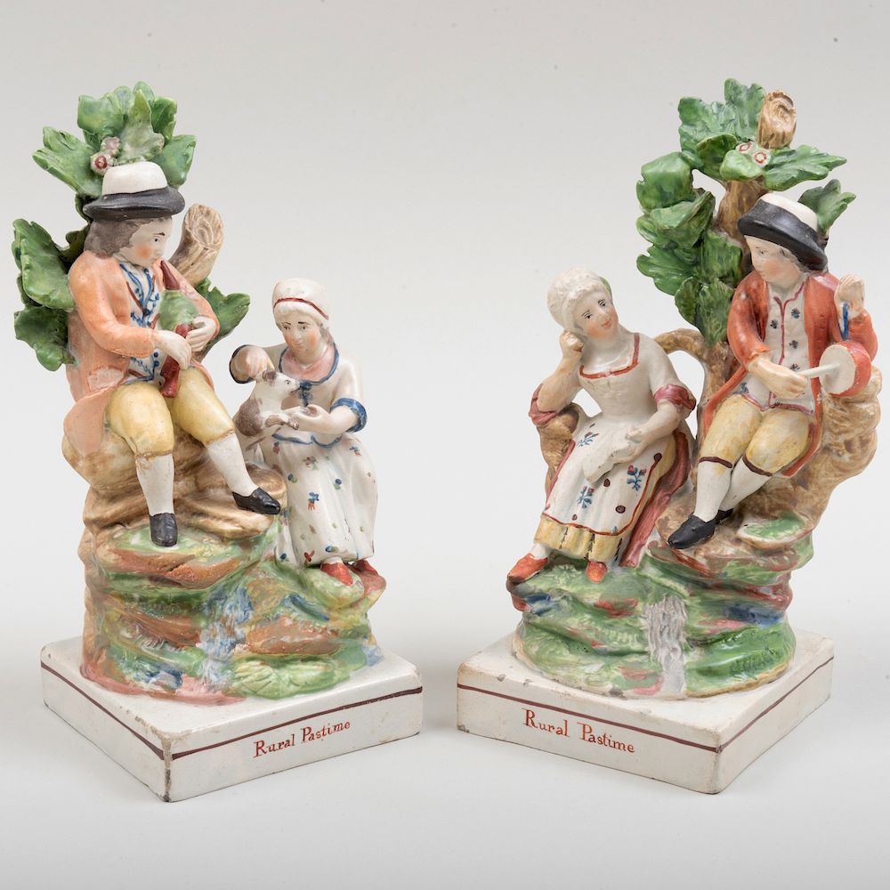 Appraisal: Pair of Staffordshire Pottery 'Rural Pastime' Figure Groups in high