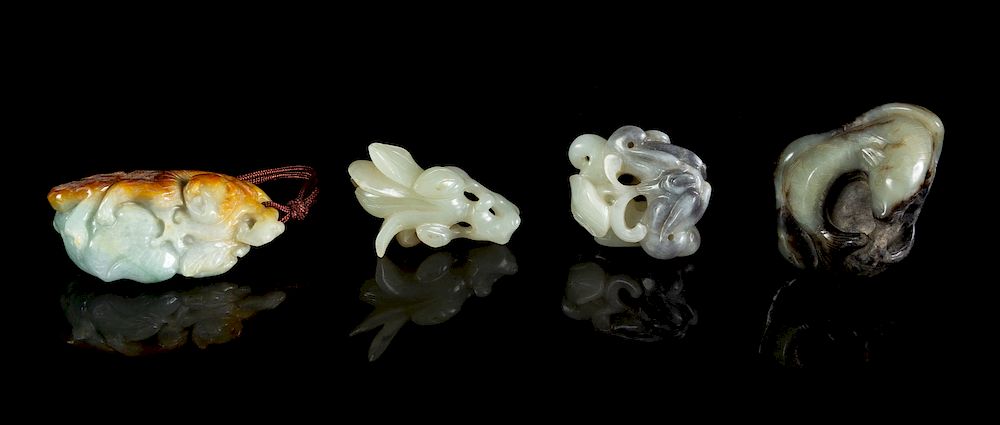 Appraisal: Four Chinese Carved Jade and Jadeite Toggles Largest height in