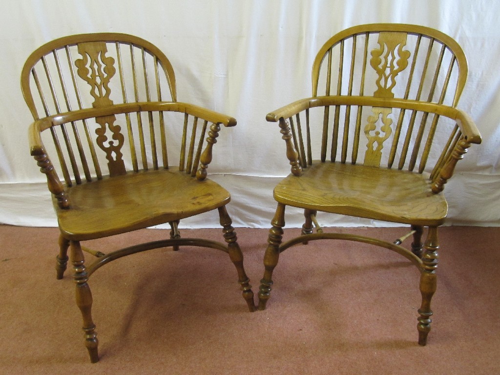 Appraisal: Two s elm Windsor armchairs raised on spindle supports cm