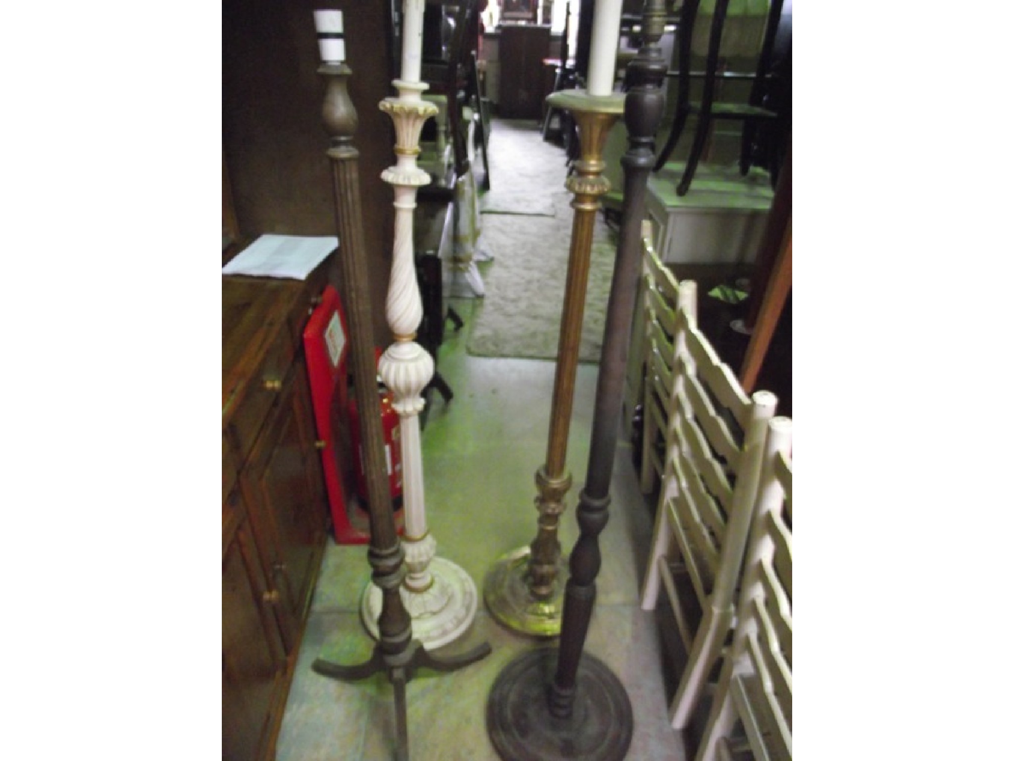 Appraisal: A gilt wood standard lamp with partially fluted column raised