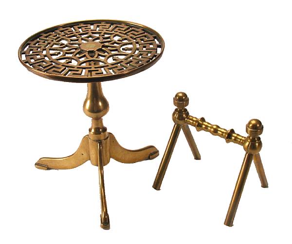 Appraisal: A brass kettle stand together with a pair of brass