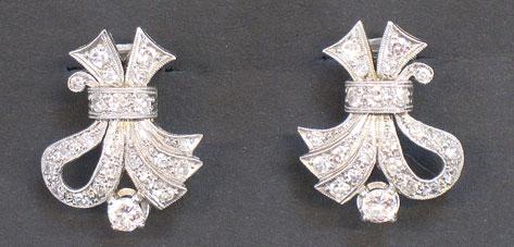 Appraisal: A PAIR OF DIAMOND-SET CLIP EARRINGS of ribbon-tie design millegrain-set