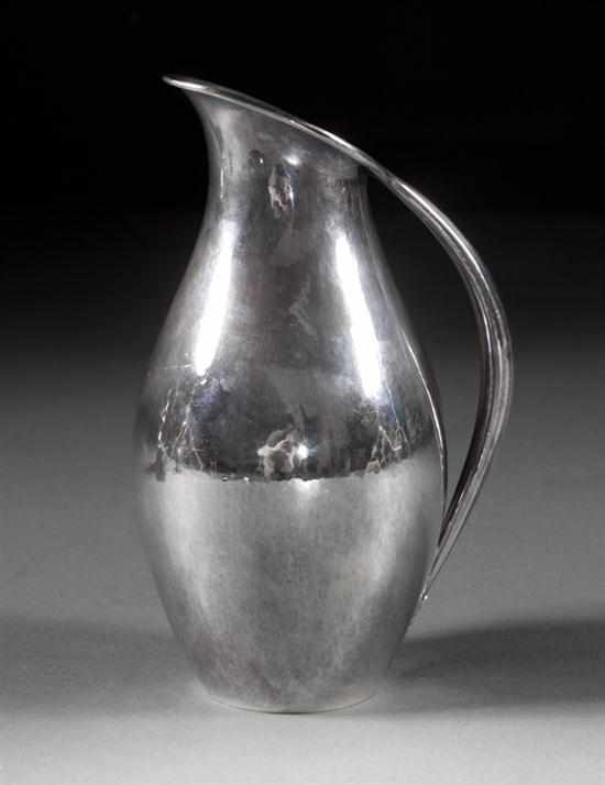 Appraisal: Danish hammered sterling silver pitcher Georg Jensen Copenhagen after a