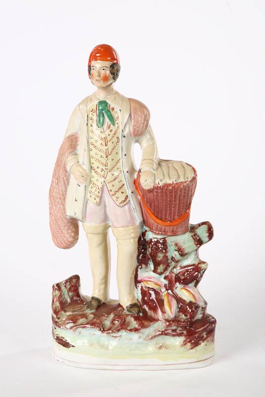 Appraisal: STAFFORDSHIRE FIGURE A fisherman with net and basket of fish