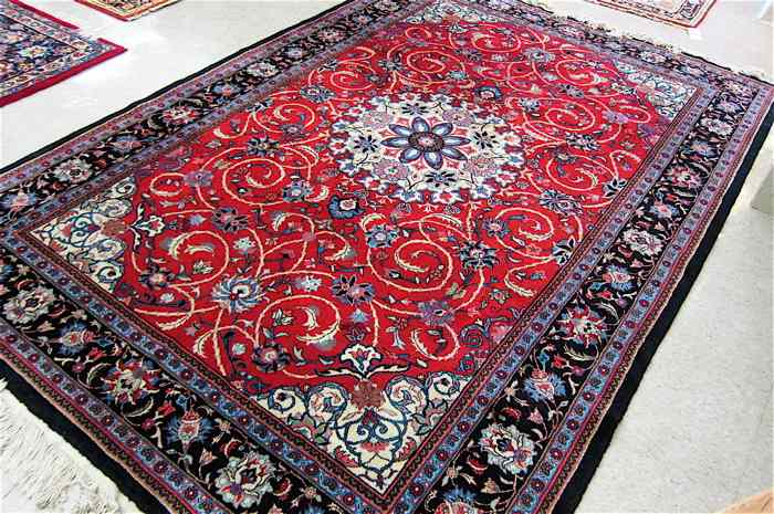 Appraisal: HAND KNOTTED ORIENTAL CARPET Indo-Persian floral and central floral medallion