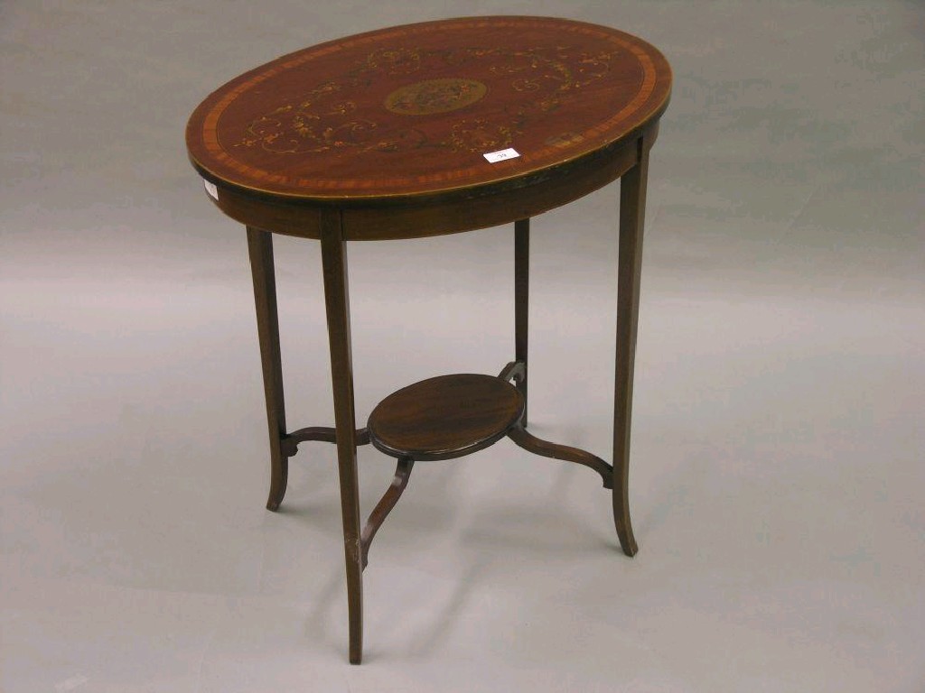 Appraisal: An Edwardian oval mahogany occasional table satinwood cross-banded top painted