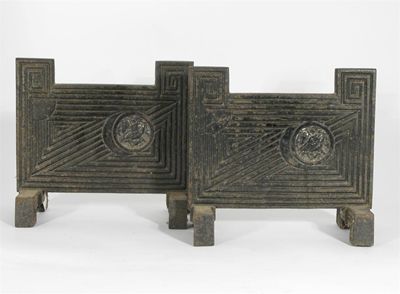 Appraisal: A pair of cast iron fire tool stands designed by