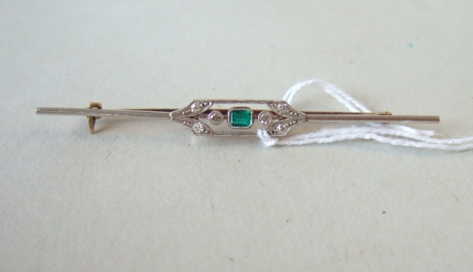 Appraisal: A gold and platinum emerald and diamond set bar brooch