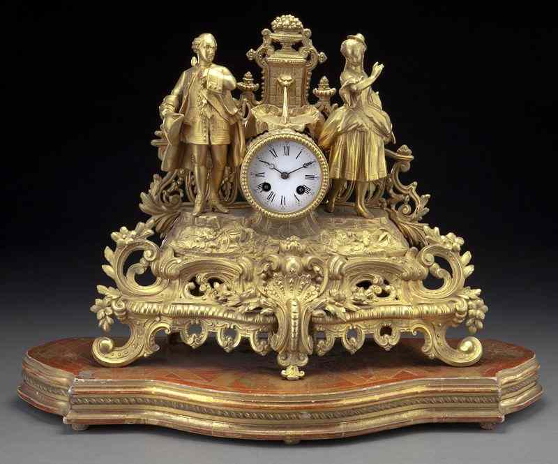 Appraisal: Louis XV style gilt bronze figural mantel clockmodeled as a