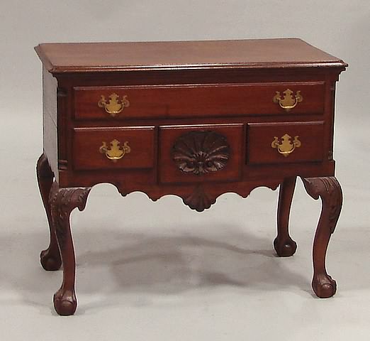 Appraisal: Molded top with invected corners thumb-molded frieze drawer center drawer