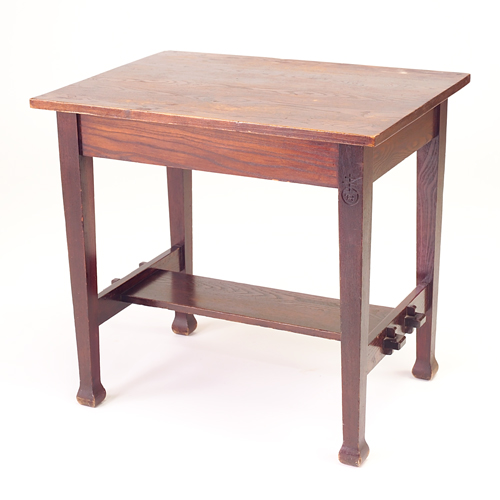 Appraisal: ROYCROFT Chestnut library table with overhanging top and lower shelf