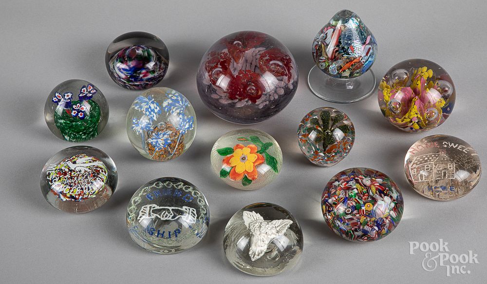 Appraisal: Thirteen glass paperweights Thirteen glass paperweights to include a floral