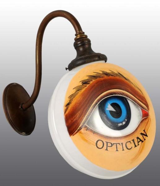 Appraisal: Painted Milk Glass Optician Advertising Globe Description Electric Painted eye