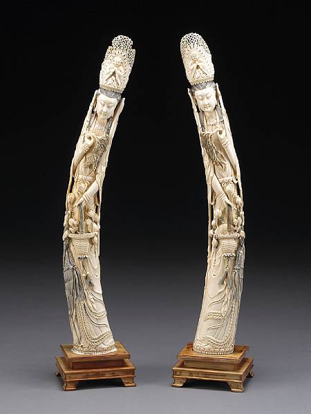 Appraisal: A pair of large tinted ivory figures of Guanyin th