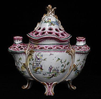 Appraisal: ROCOCO-STYLE FAIENCE FLOWER HOLDER AND COVER The trefoil-fronted bowl with