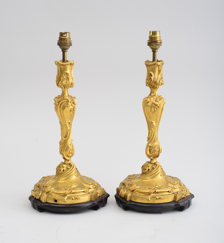 Appraisal: PAIR OF LOUIS XV STYLE GILT-BRONZE CANDLESTICKS Each spiral-twist baluster-form