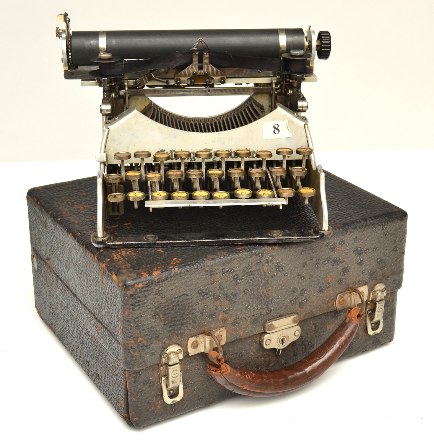 Appraisal: A CASED VINTAGE FOLDING TYPEWRITER