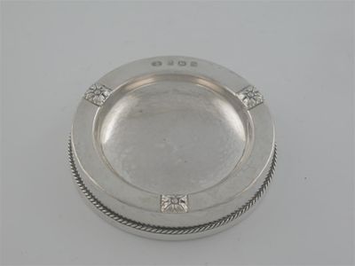 Appraisal: A modern pin tray circular form hammered finish plain border