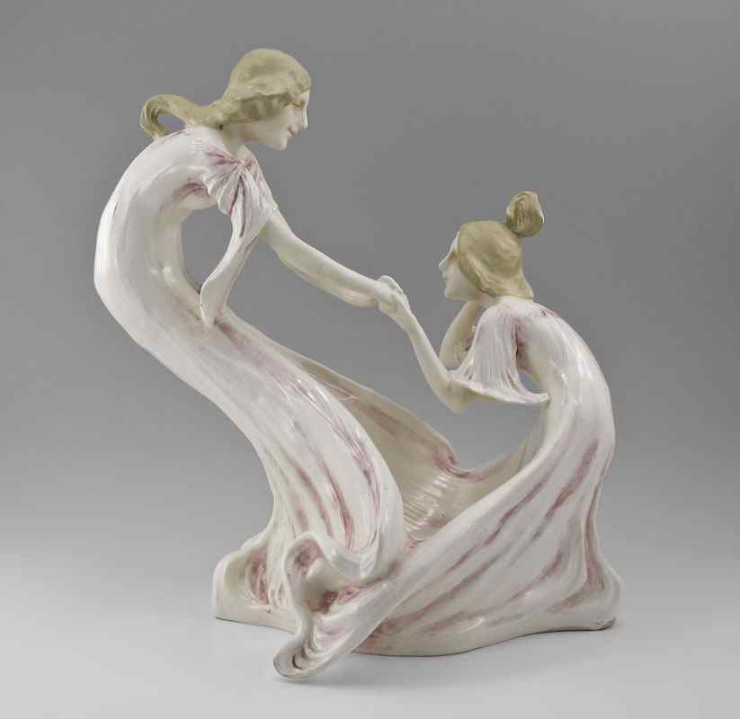 Appraisal: ART NOUVEAU CERAMIC FIGURAL GROUP Two girls in a playful