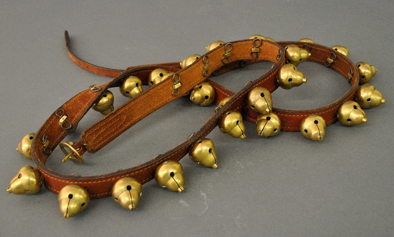 Appraisal: - Brass sleigh bells with leather strap l -