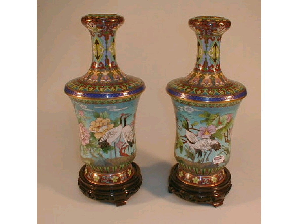 Appraisal: A pair of modern Chinese cloisonne vases on hardwood stands