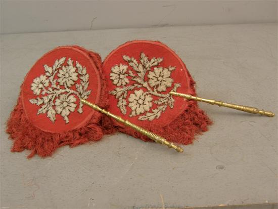 Appraisal: Pair of th century pink needlework fans with gilt and