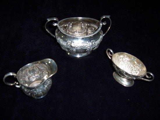 Appraisal: A two-handled sugar basin embossed floral and scroll decoration TH